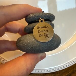 Gray Stone Sculpture with Gold Charm